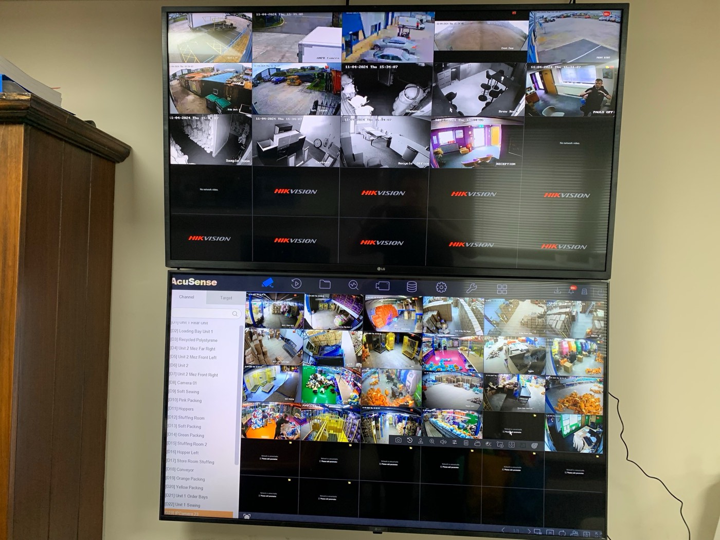 CCTV camera fitted under the eaves of a commercial building