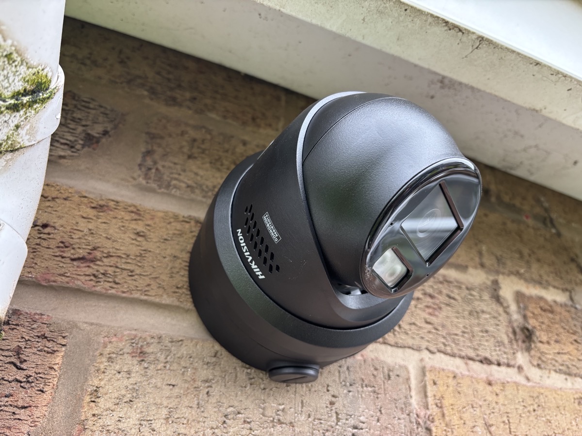 CCTV camera installed under a windowsill