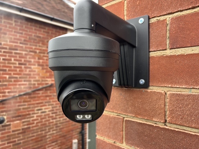 CCTV camera on a wall-mount bracket